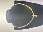 Omega Wende Collier Gold / Silber mit Perle