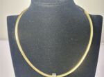 Omega Wende Collier Gold / Silber mit Perle